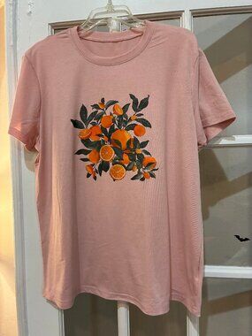 NWOT light pink T-shirt with orange fruit graphic Size XXL